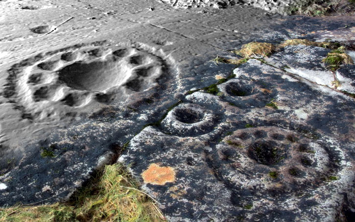 Close up of circular patterns in the rock art
