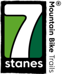 7stanes logo, a white seven in a black box with green background. The word 'stanes' is under the '7' and the words 'Mountain Bike Trails' beside it. 