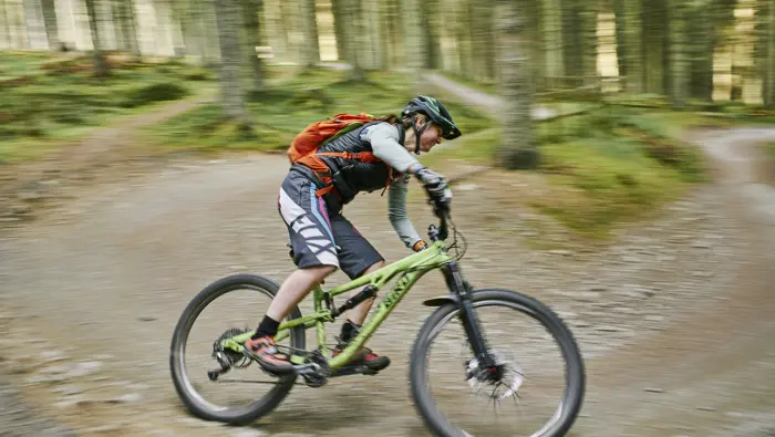 Cyclist going round a corner at speed.