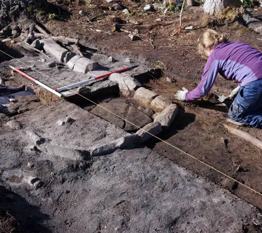 A person during an archaeoligcal dig.