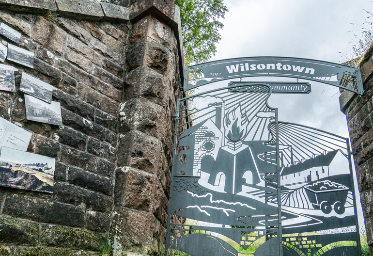 Stone wall with metal gates