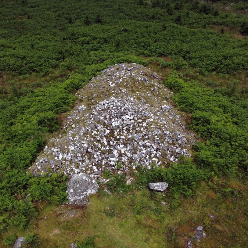 A drone shot of the cairn at Knockman Woods
