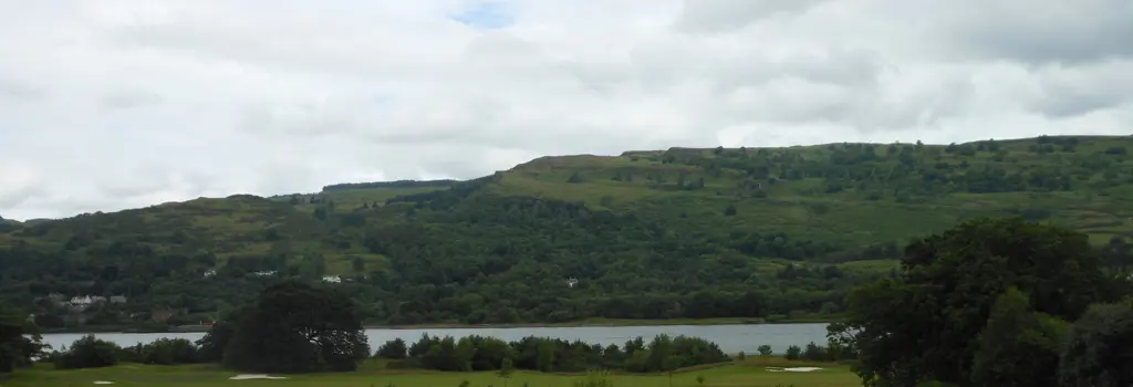 Image of Kilpatrick Hills against a cloudy sky. 