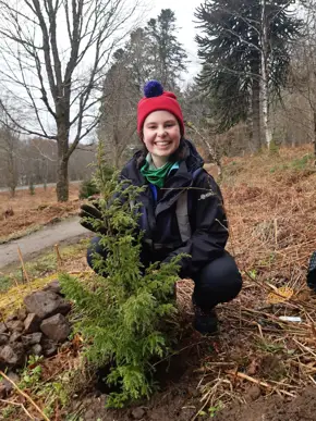 Female apprentice smiling at camera