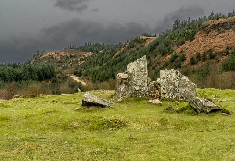 Old rock grave on a hillside next to the sea